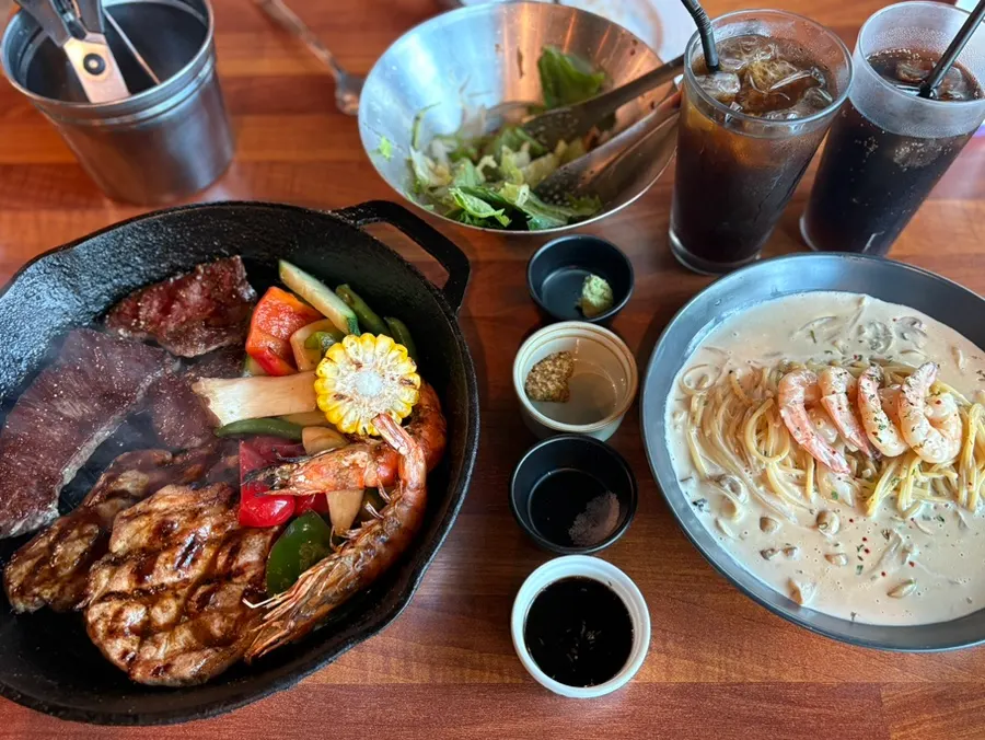 The couple set spread, upgraded to a steak platter
