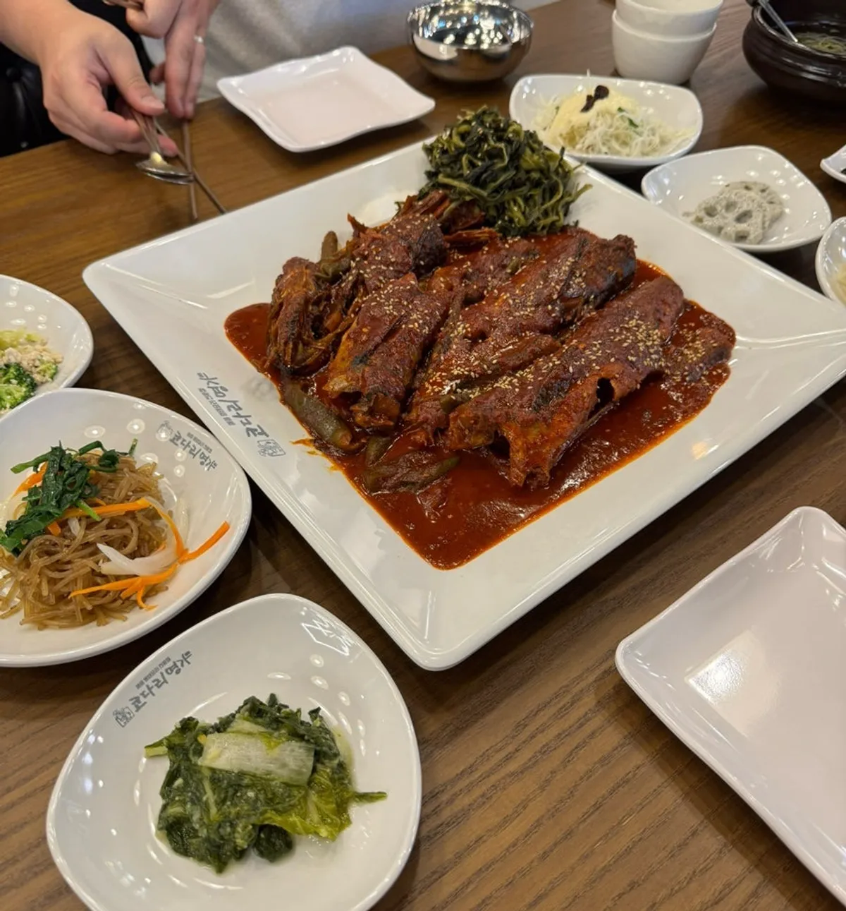 Table spread with bean sprout soup and banchan