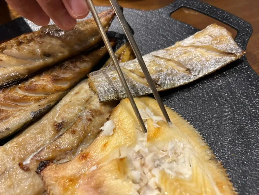 Grilled fish with the flesh picked apart