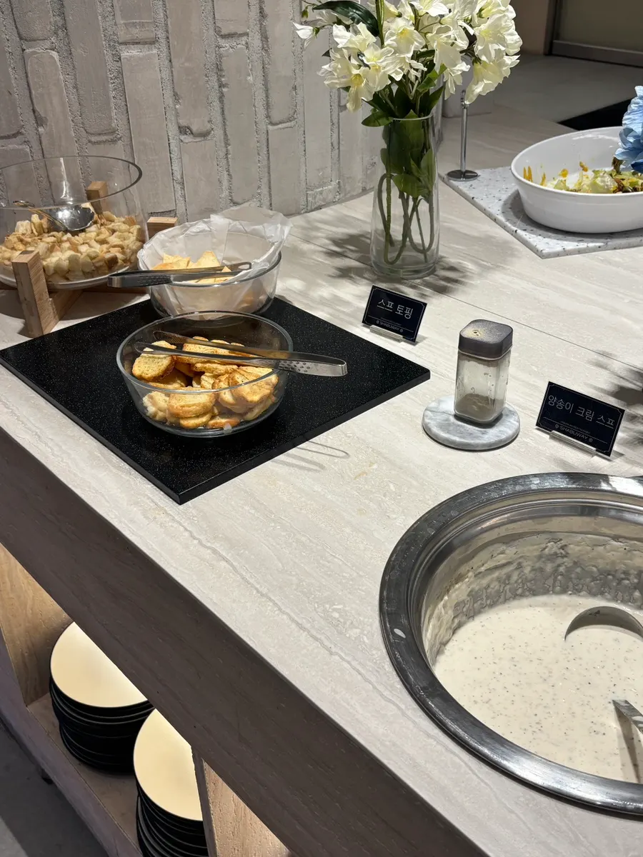 A plate filled with a variety of salad bar dishes