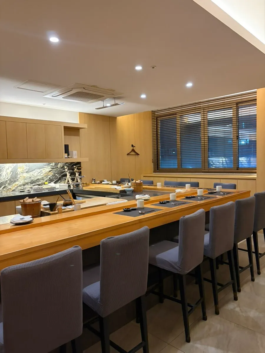 Bar table and coat hooks inside Sushi Ryeo