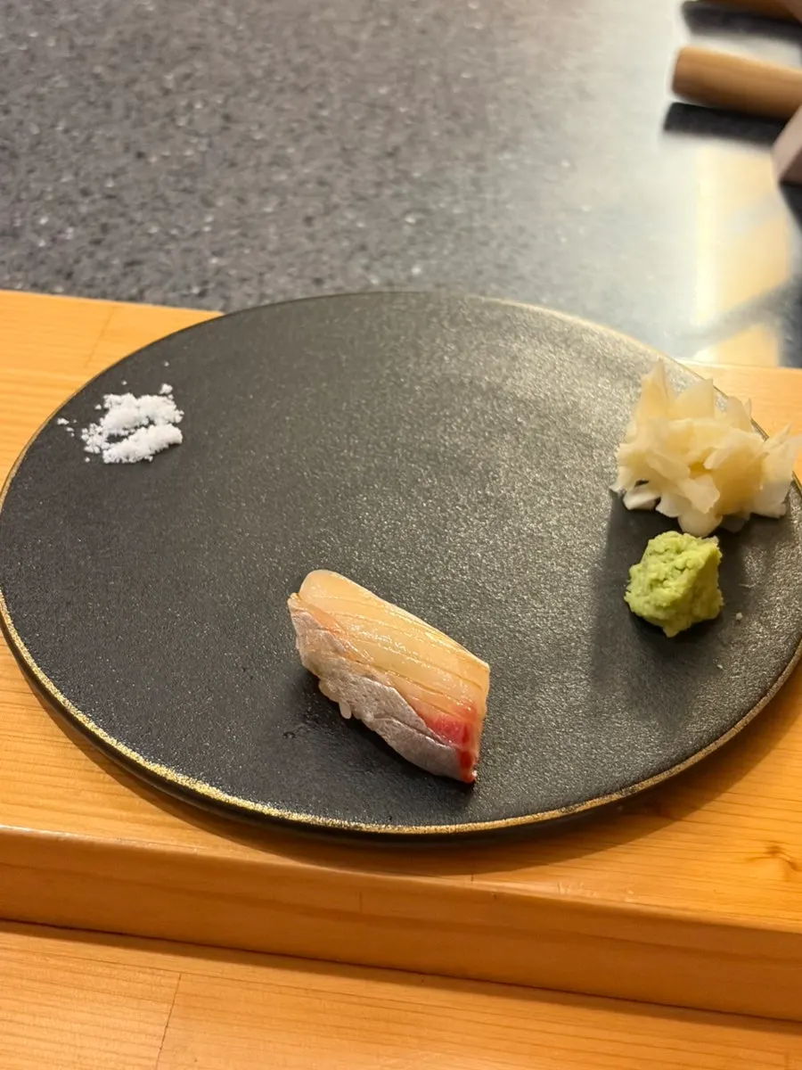 A piece of red seabream belly sushi