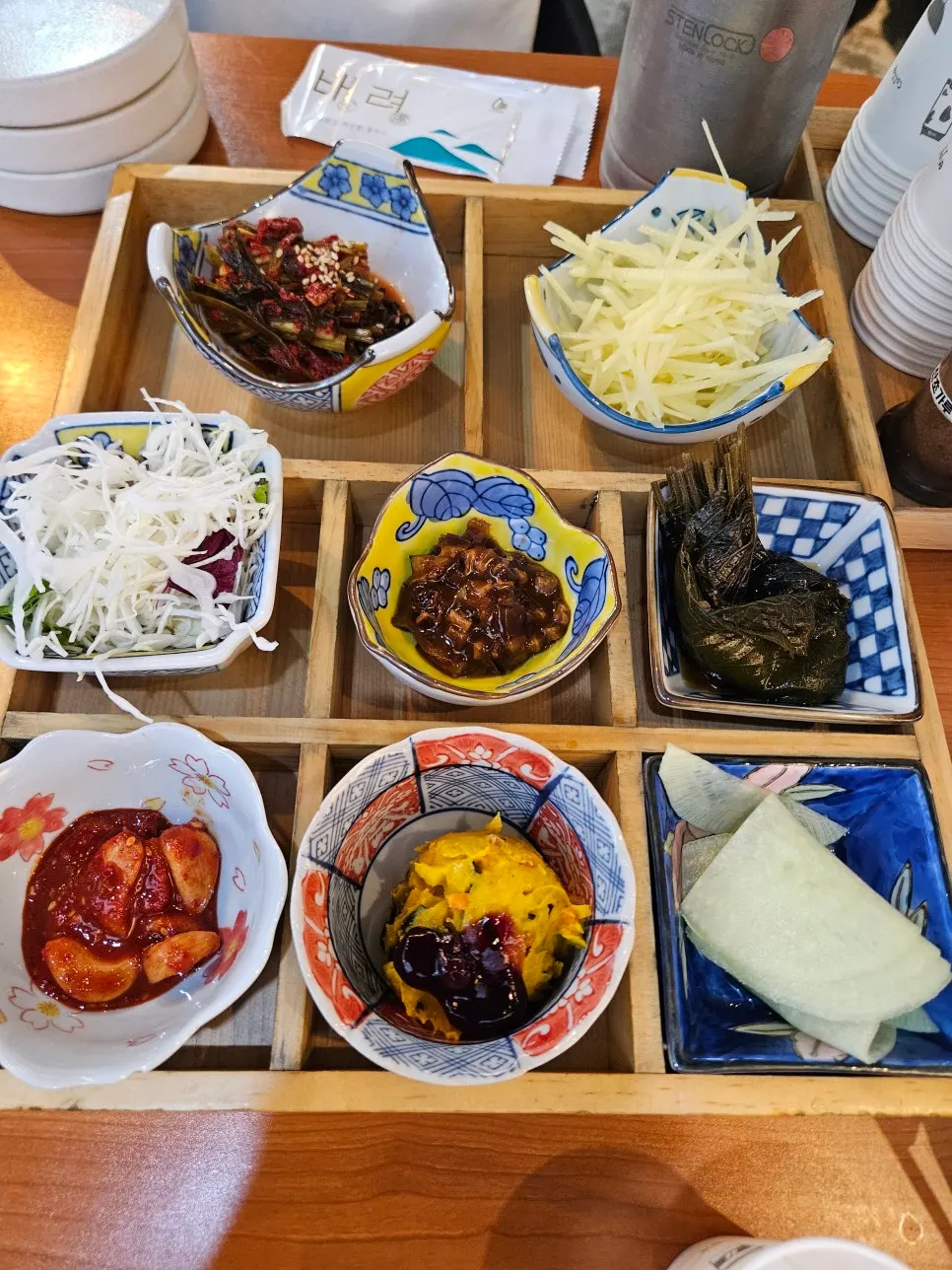 Basic side dishes and fish spicy stew on a wooden tray