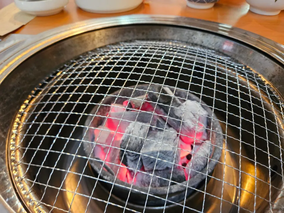 Freshwater eel being warmed over charcoal fire