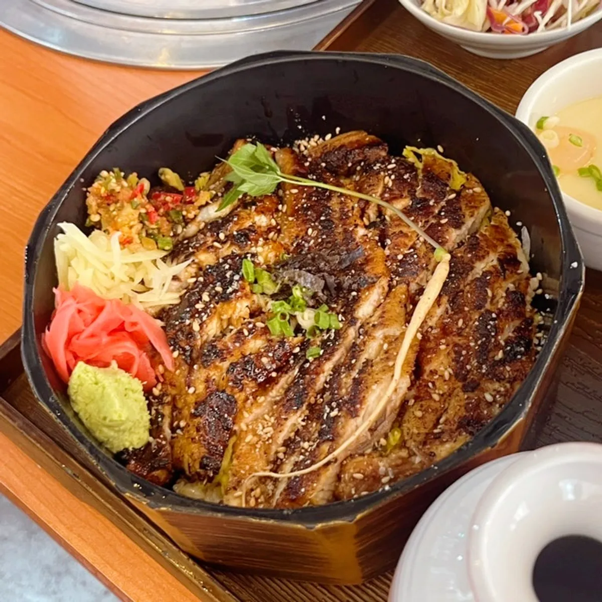 Full eel rice bowl set with salad, steamed egg, and green tea