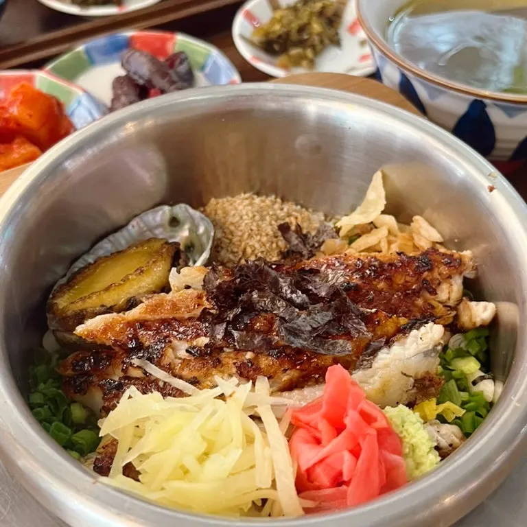 Chunky abalone pieces inside the hot pot rice
