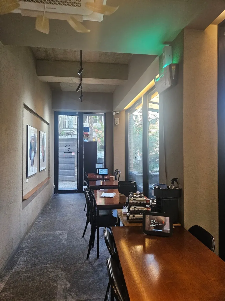 Ryu-eun's first-floor interior lit by floor-to-ceiling windows