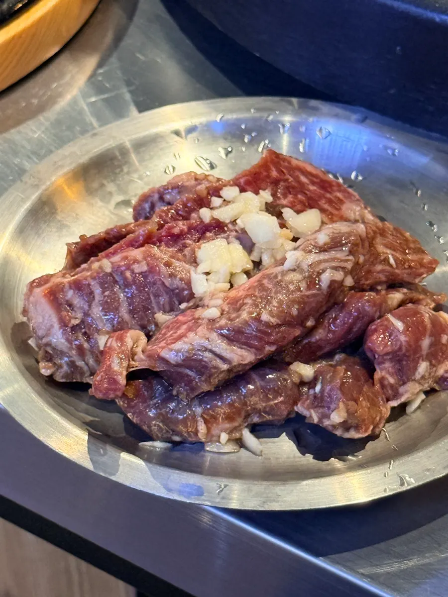 Garlic marinated anchangsal grilling over charcoal