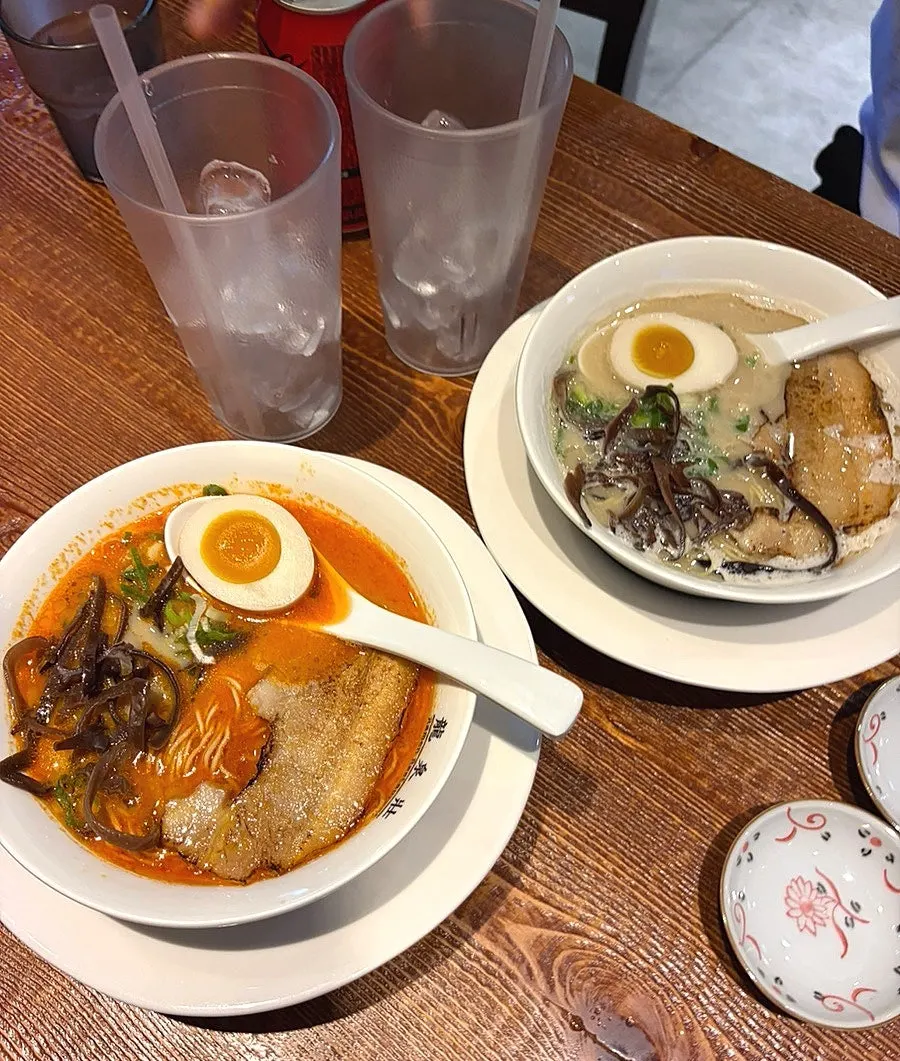 Two bowls of ramen and karaage set on the table