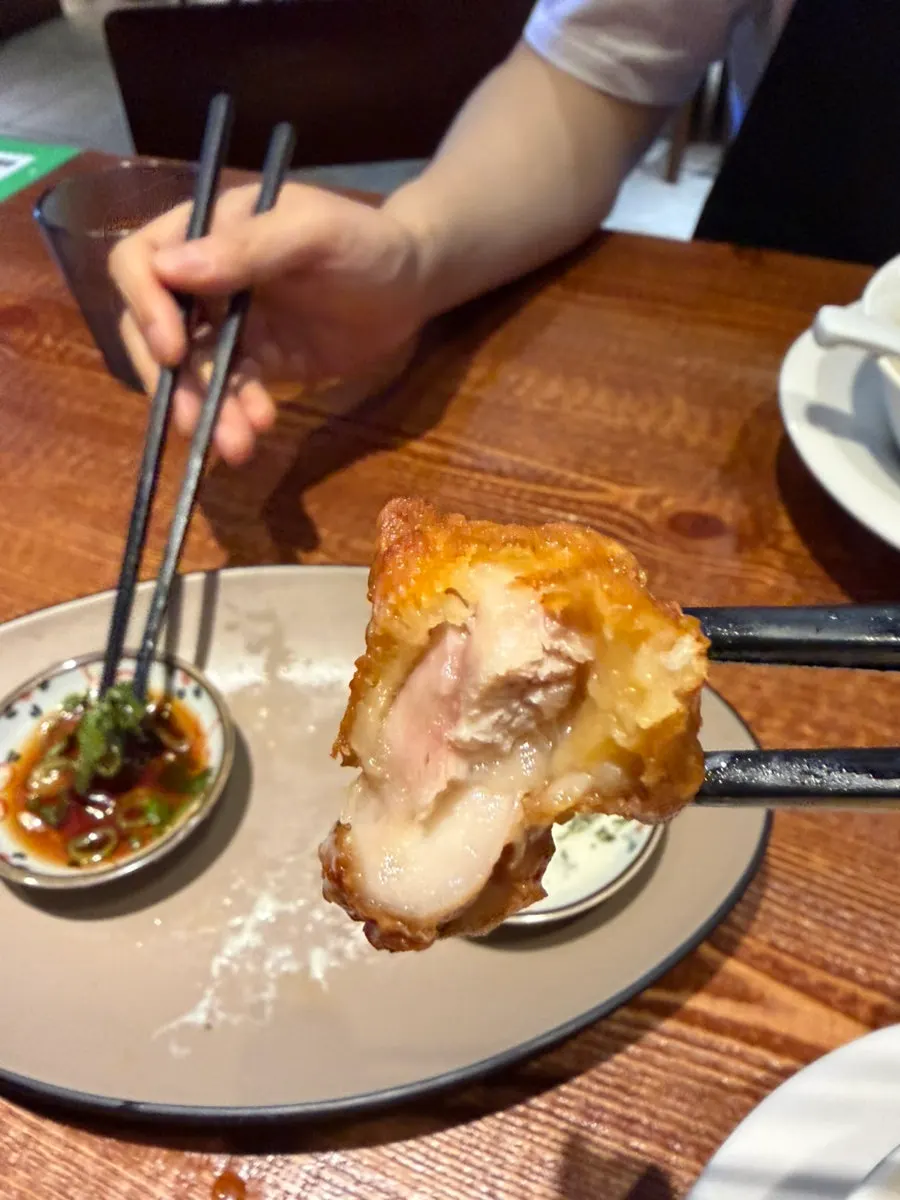 A chopstick-full of tonkotsu ramen