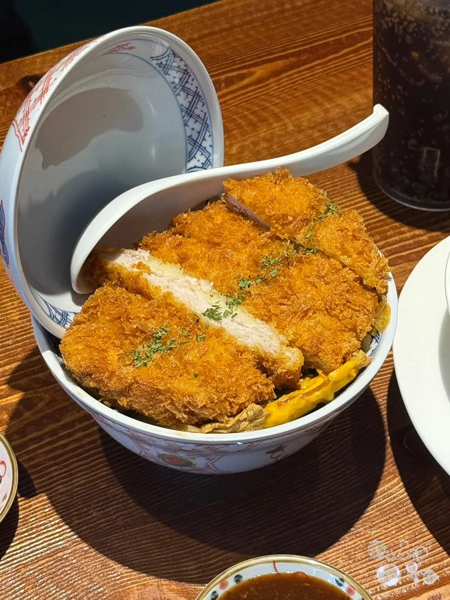 Katsudon topped with a thick pork cutlet