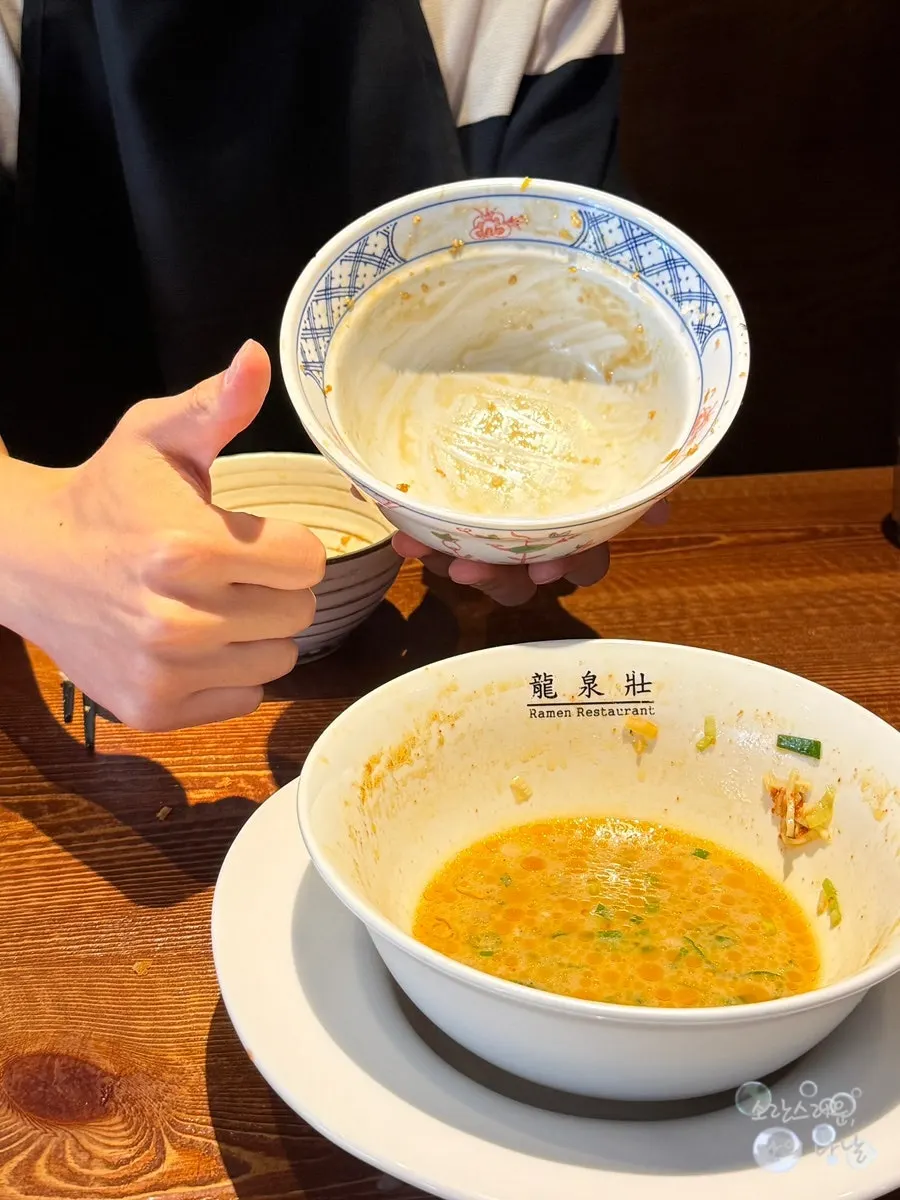 Giving a thumbs up in front of an empty bowl