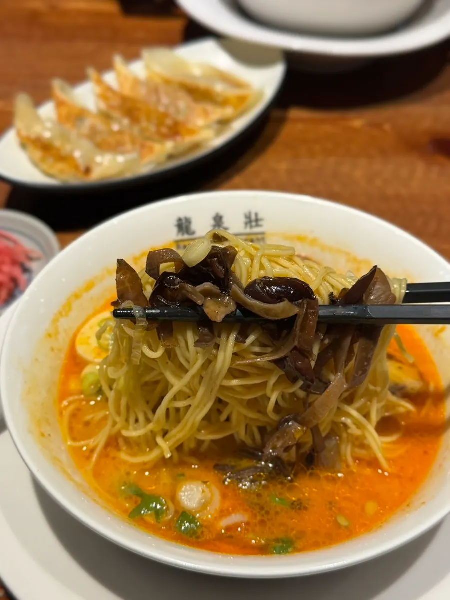 Wood ear mushroom and springy noodles visible in the ramen