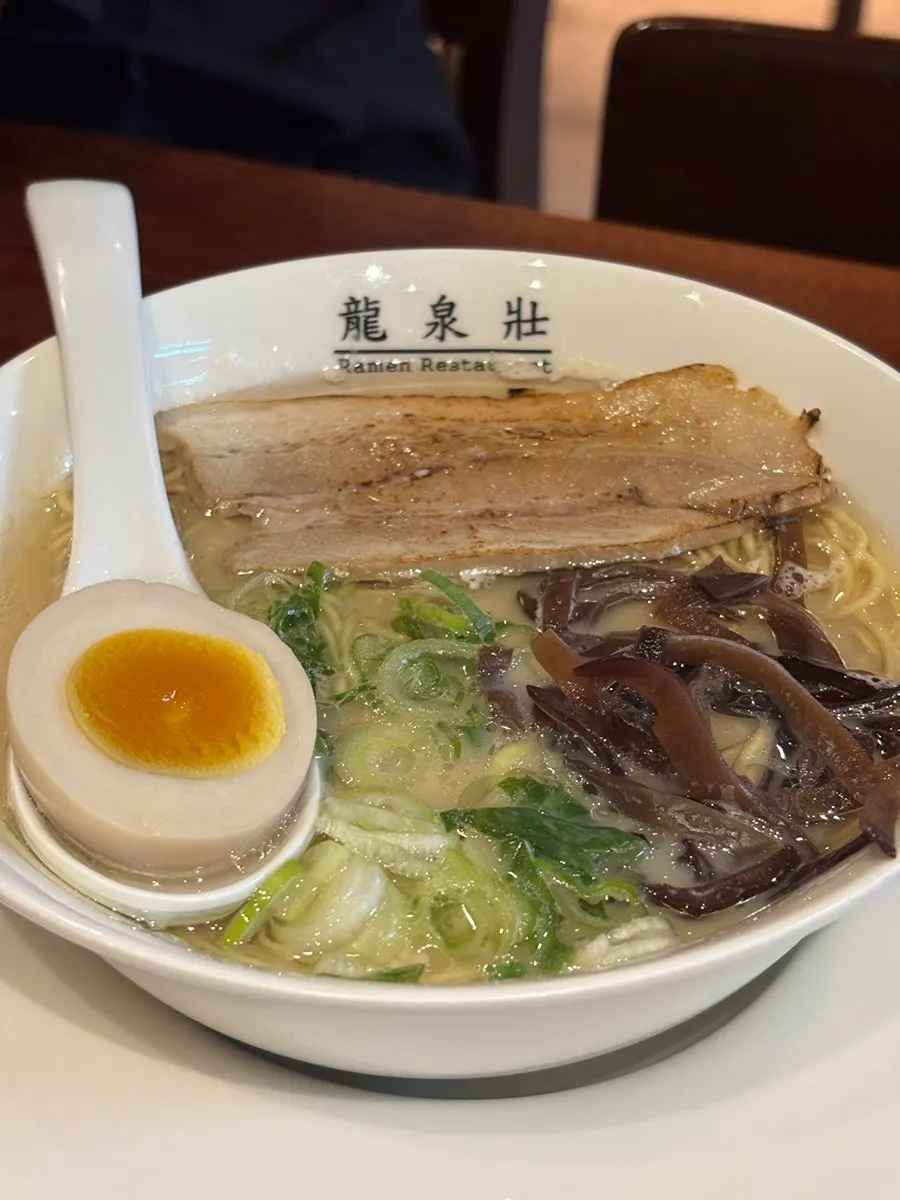 Original Ryusenso ramen topped with chashu and soft-boiled egg