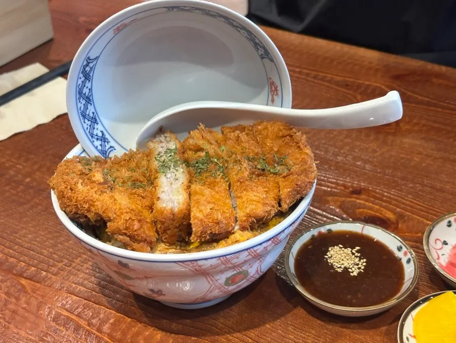 Katsudon topped with crispy pork cutlet