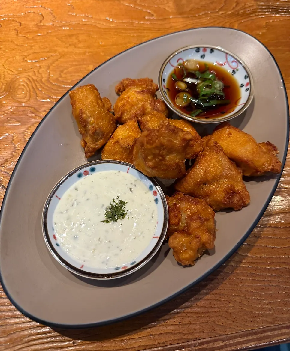 A plate of karaage served with sauce