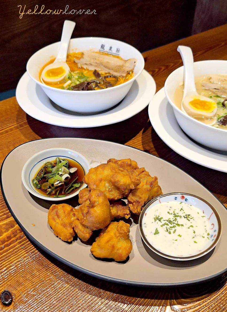 Two bowls of ramen and karaage set out on the table