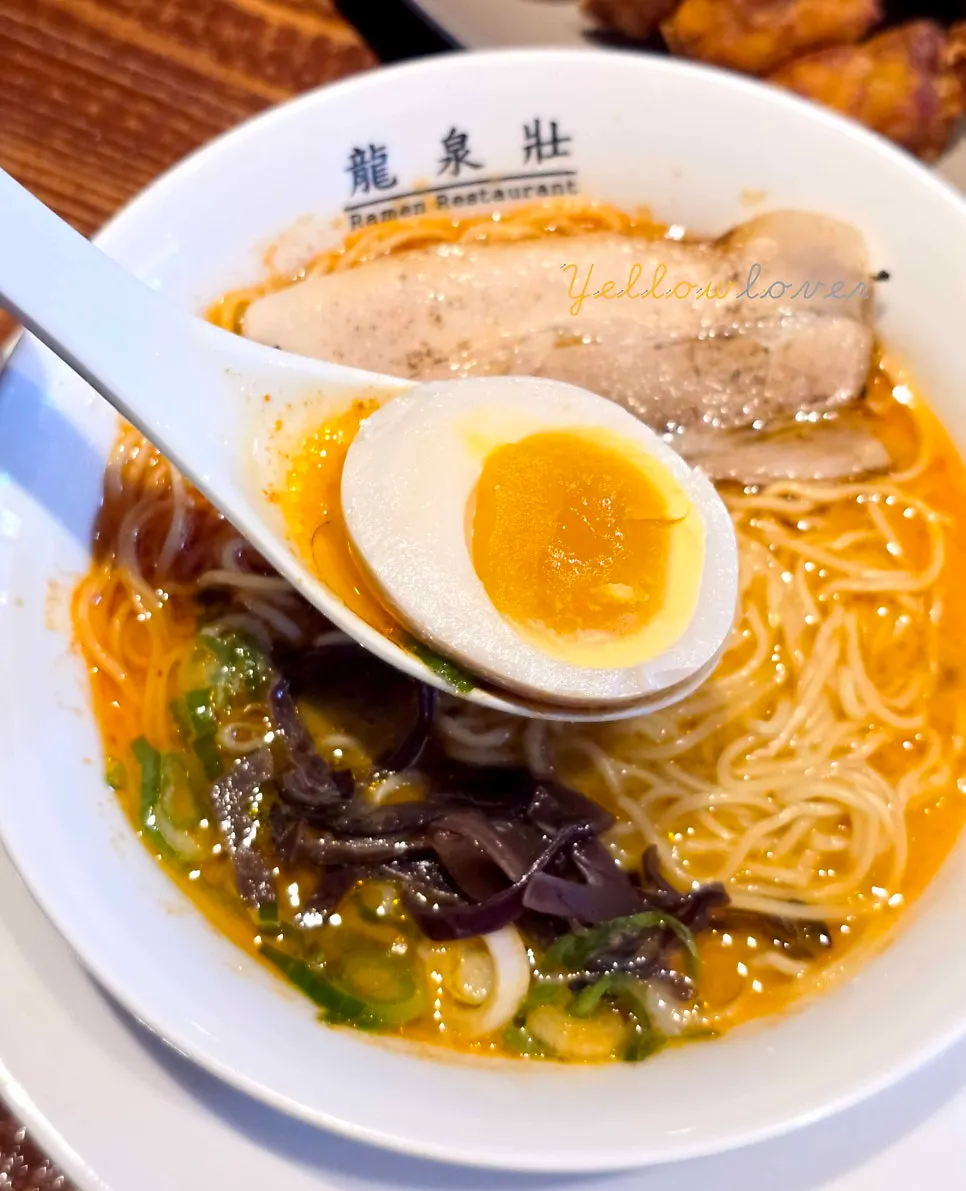 Close-up of thin noodles lifted with chopsticks