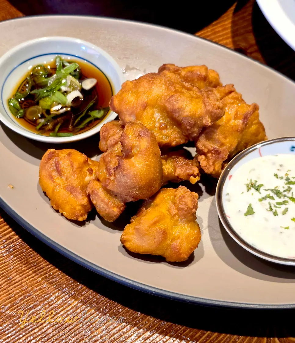 Soy sauce and nutty sauce served alongside the karaage