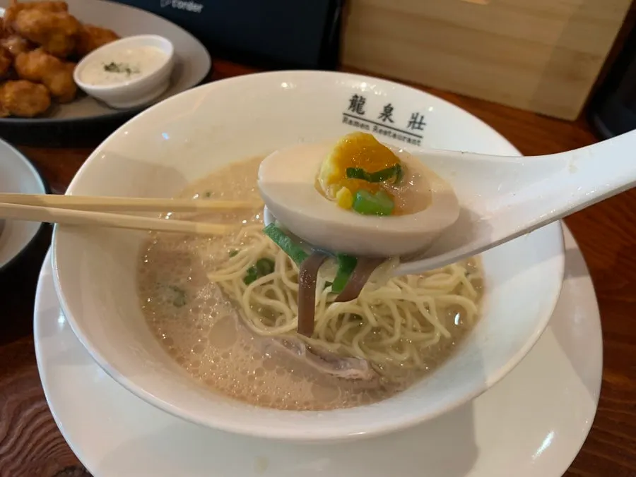 A spoonful of the ramen broth