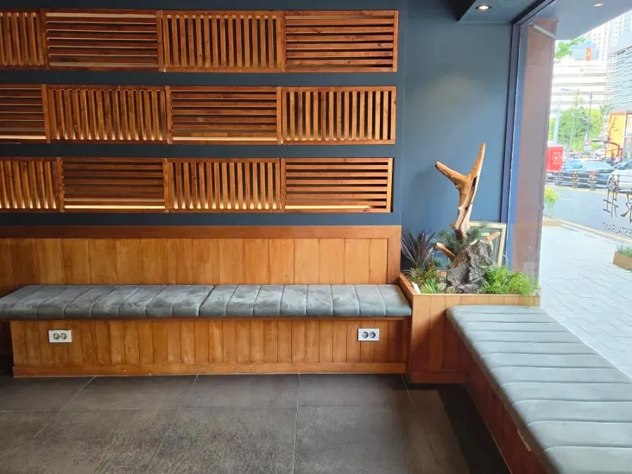 Seating with a bar table and regular tables