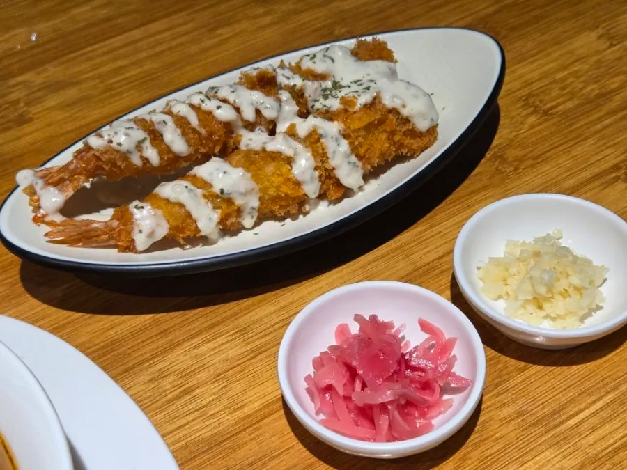 Two pieces of fried shrimp ordered as a side