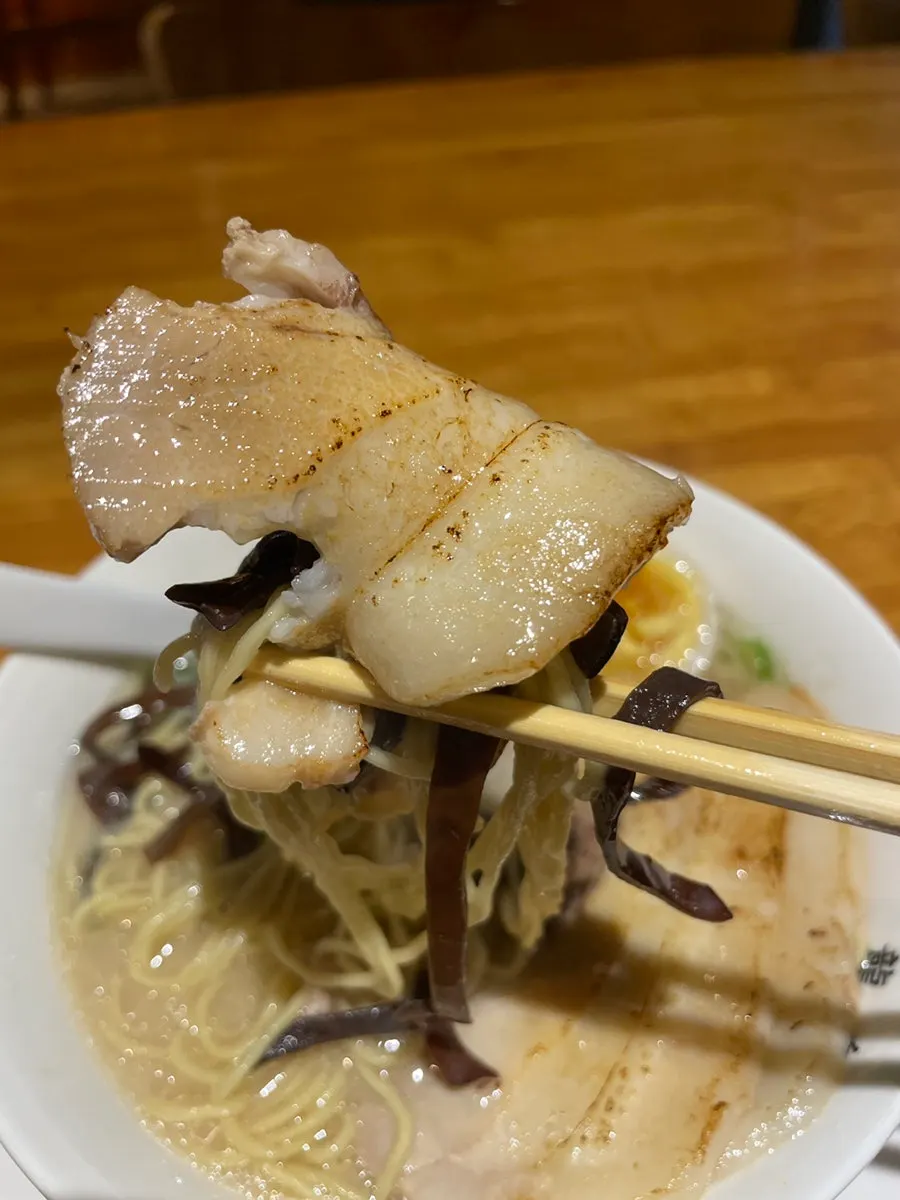 Ryusenso ramen on the table with a side of ginger