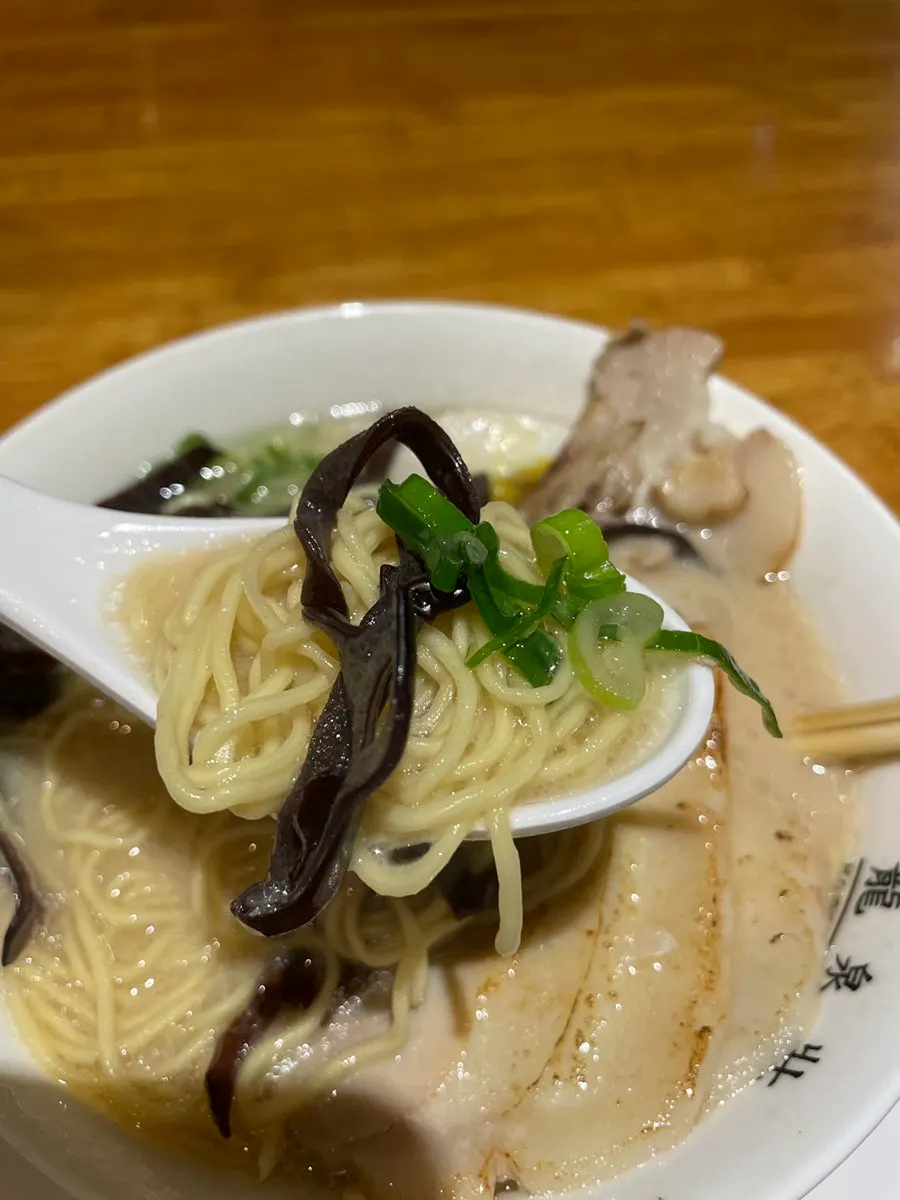 Close-up of Ryusenso ramen topped with a large slice of chashu