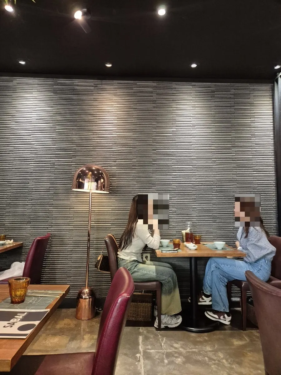 SABAL's interior with ceramic decor on the shelves