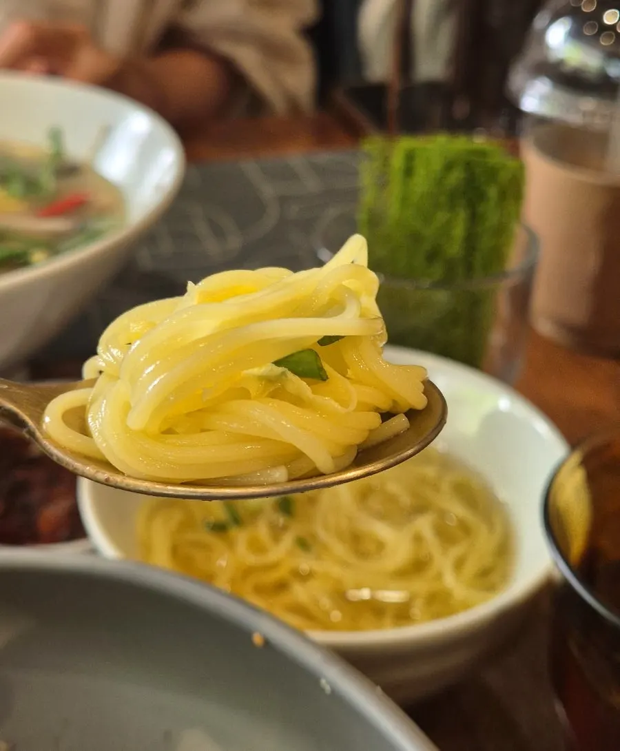 A bite of perilla oil bibimbap wrapped in gamtae