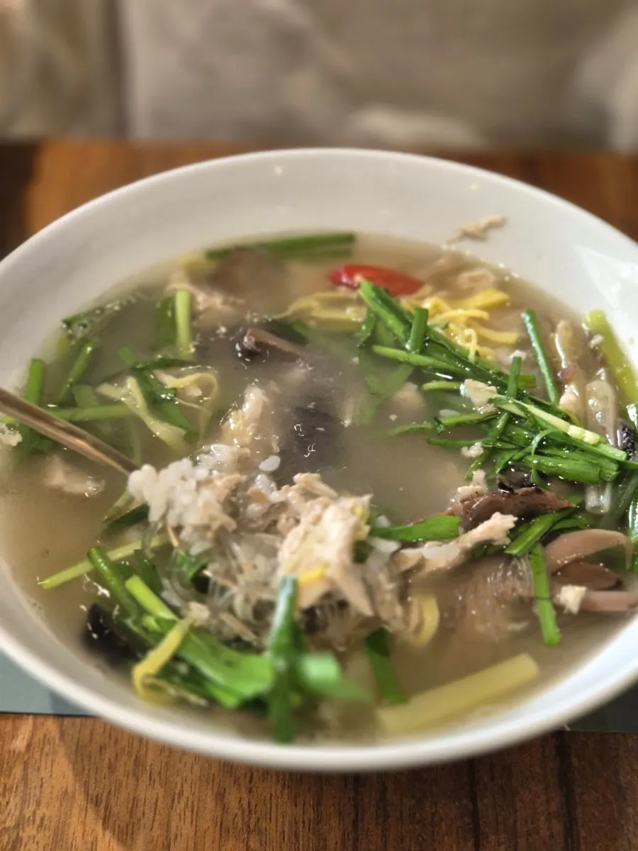 Chicken gomtang broth topped generously with chives