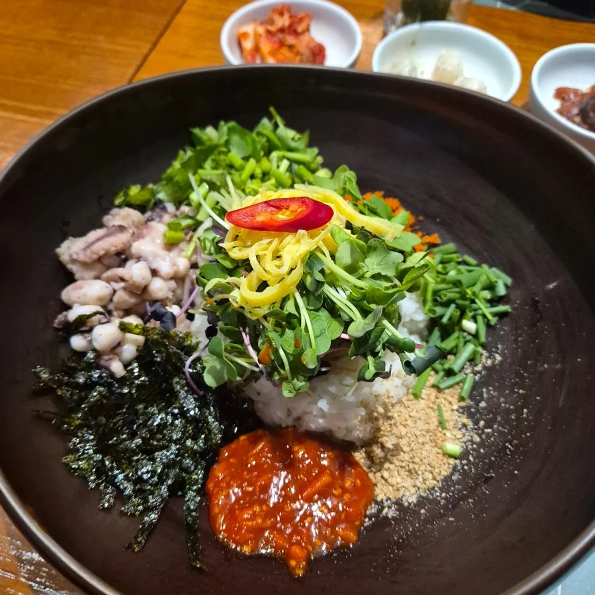 Tangtang octopus deodeok gochujang rice topped with octopus and flying fish roe