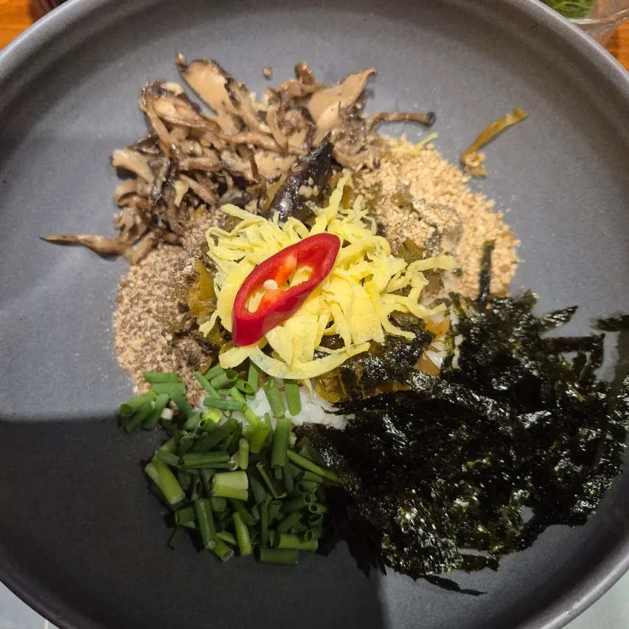 Gamtae perilla oil rice topped with mushrooms and egg garnish