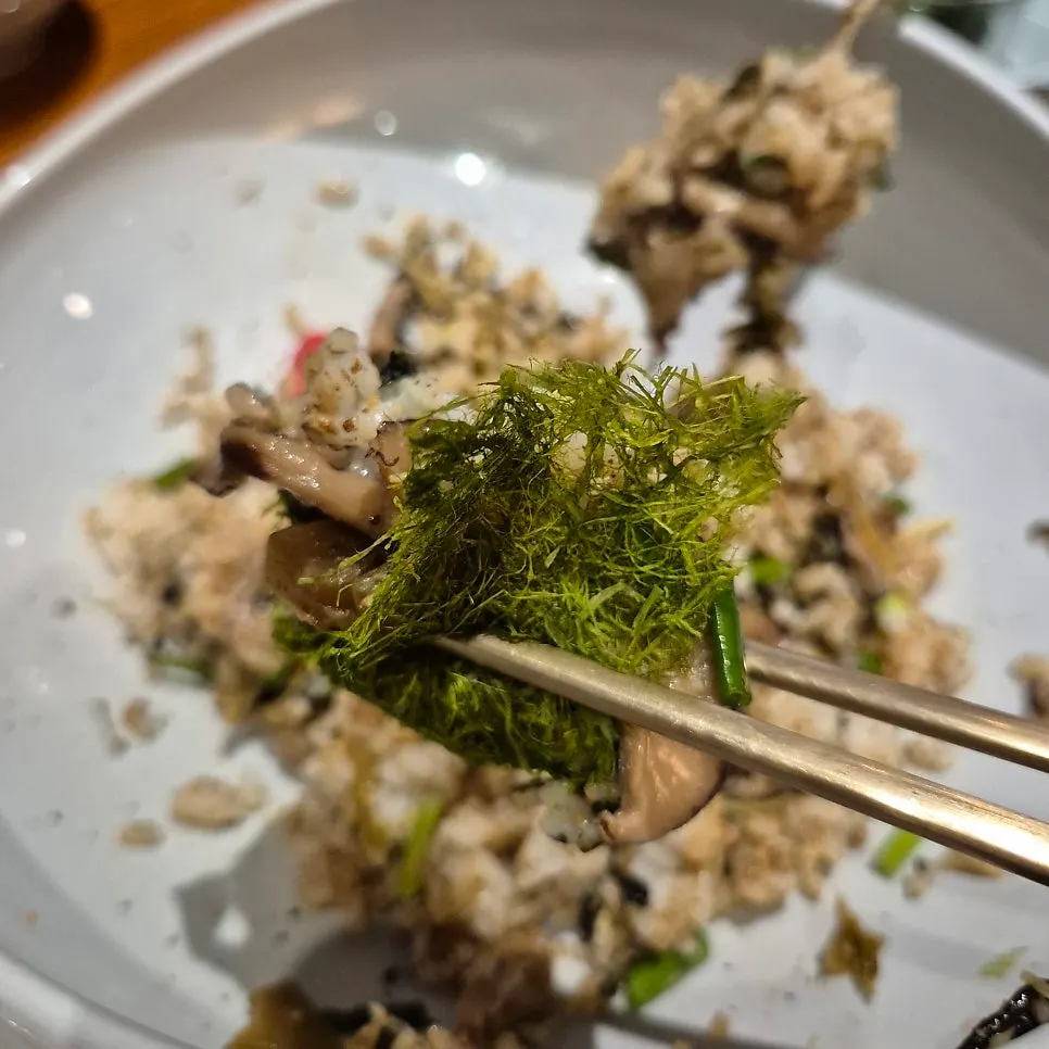 A bite of perilla oil rice wrapped in gamtae