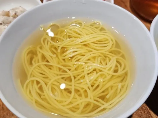 A bowl of mini noodles in anchovy broth