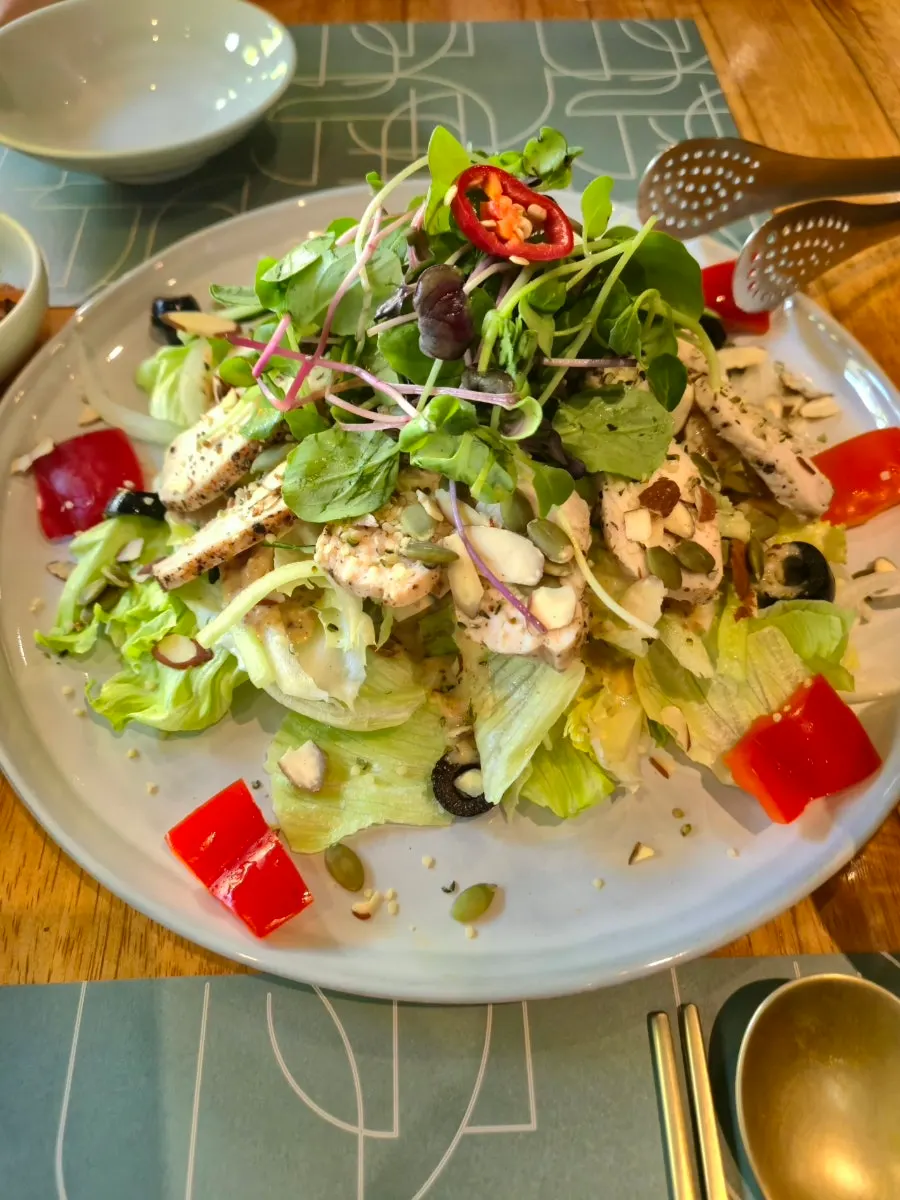 Chicken hemp seed salad topped with sous vide chicken breast
