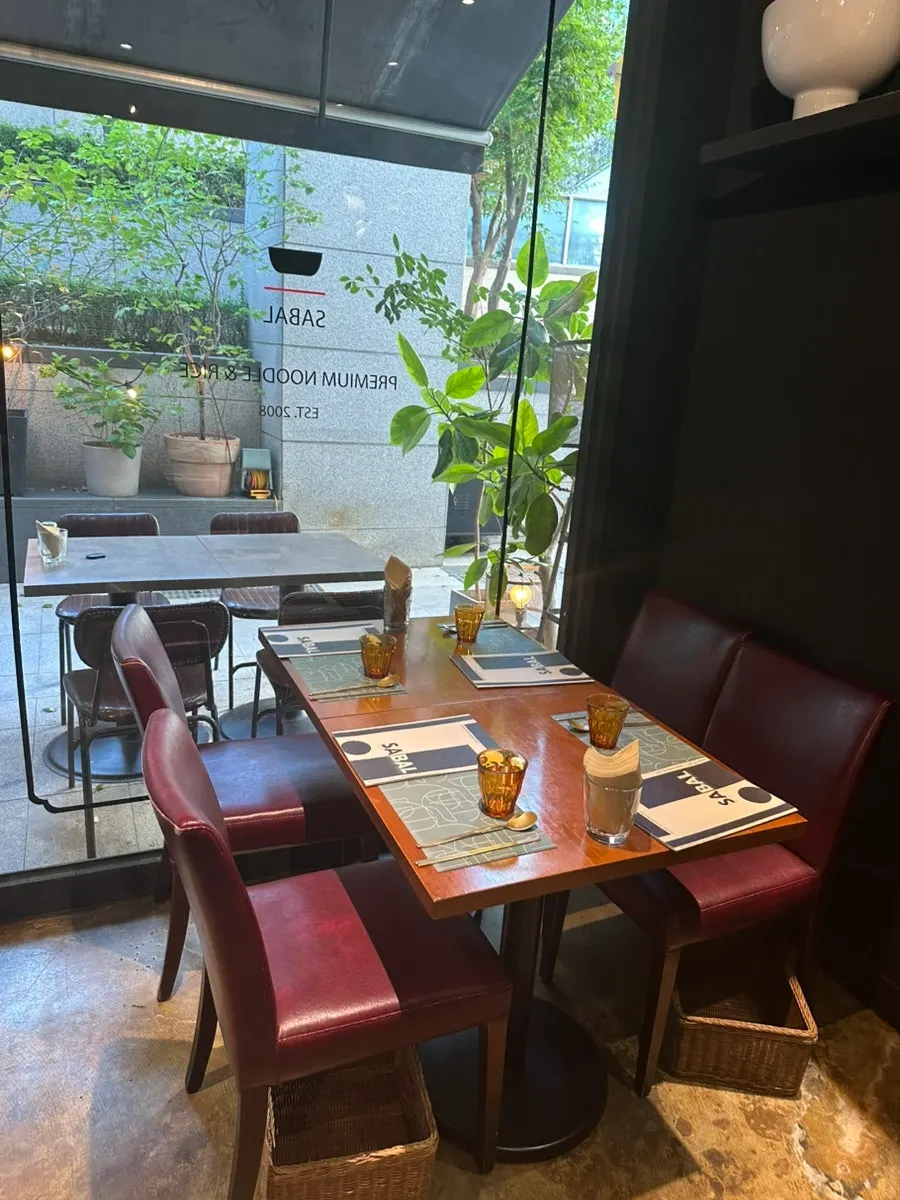 Pre-meal porridge and table setting at SABAL