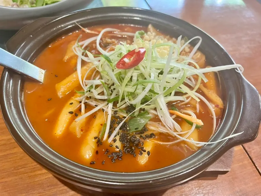 SABAL's mini tteokbokki topped with scallion garnish