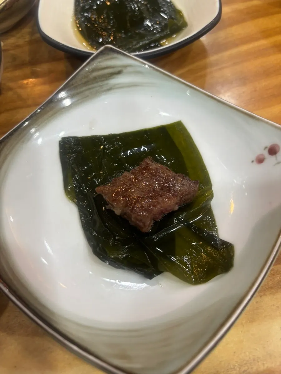 A piece of hanwoo myeongpum dipped in salt