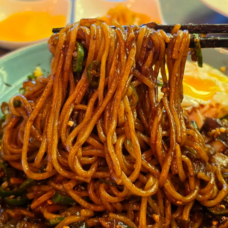 Pepper jjajang topped with egg and peppers