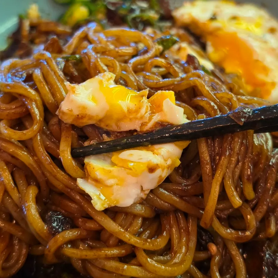 Pepper jjajangmyeon with a runny-yolk egg