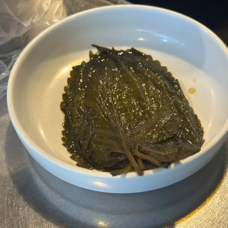 Pickled perilla leaves served alongside the gopchang