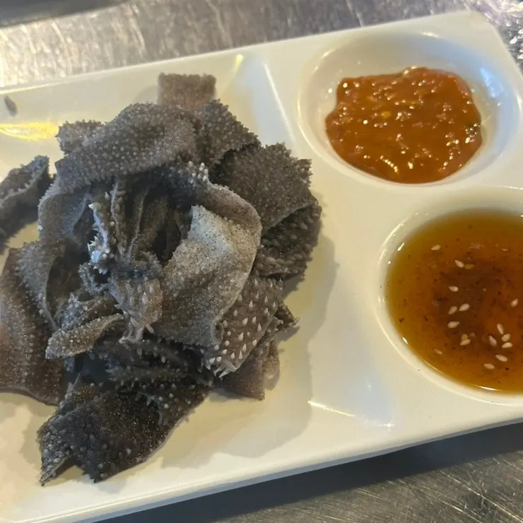 Plate of complimentary cheonyeop (beef tripe)