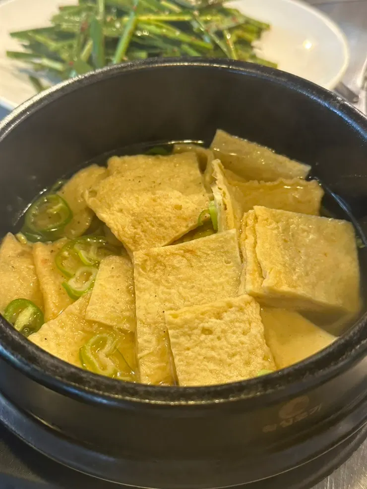 Odeng-tang (fish cake soup) simmering in a stone pot