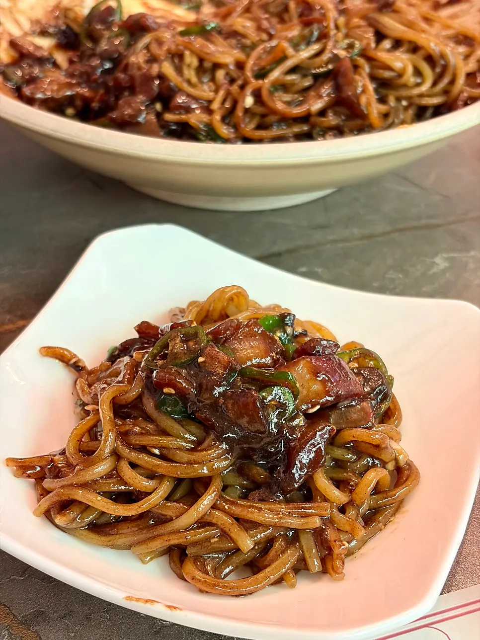 Table with gochu-jjajang and the other dish together