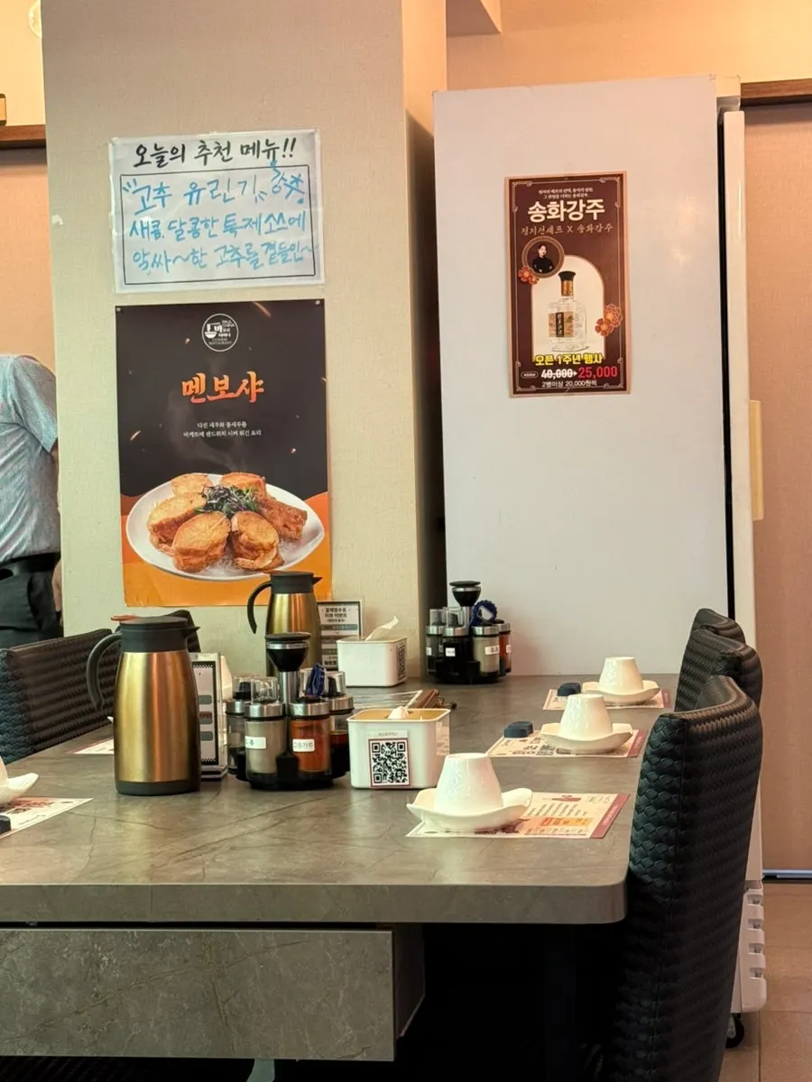 Interior of the Chinese restaurant with sauce bottles on the table
