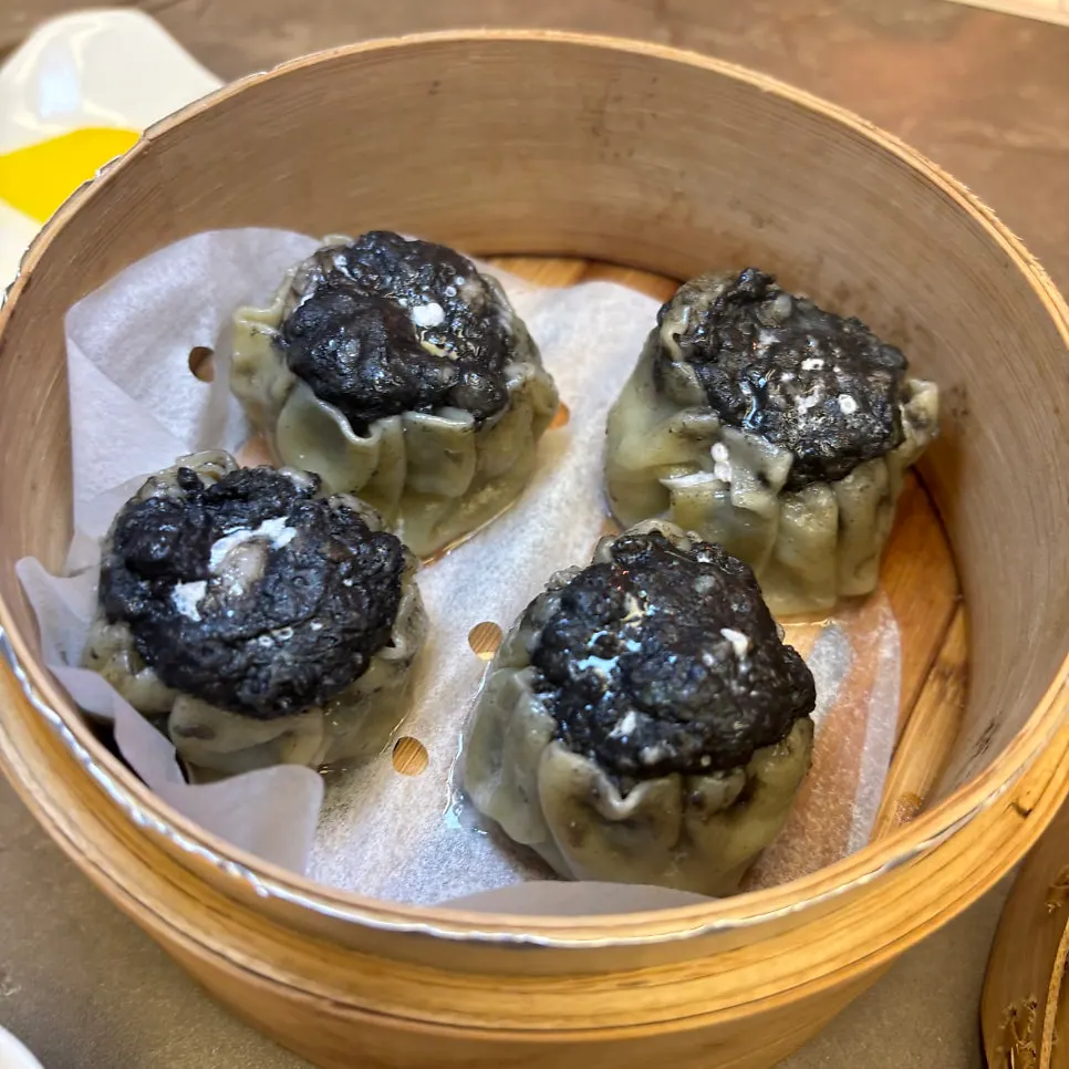Cross-section of a bitten truffle siu mai
