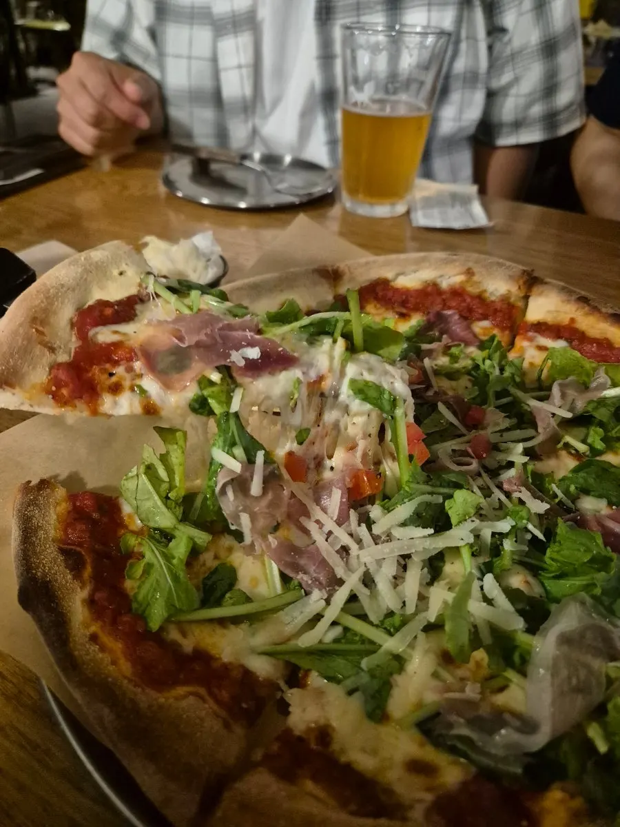 Wood-fired pizza topped with fresh ingredients