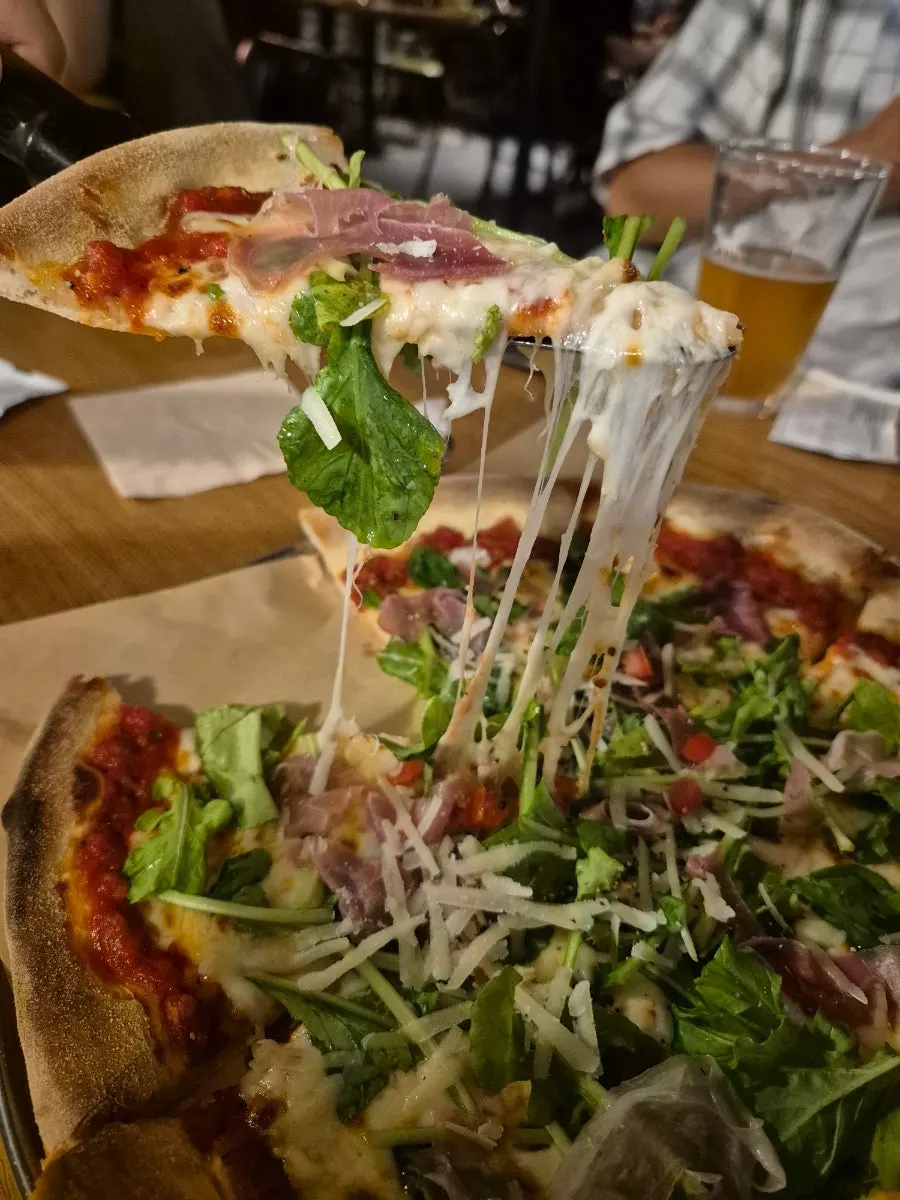 Pizza with stretchy cheese