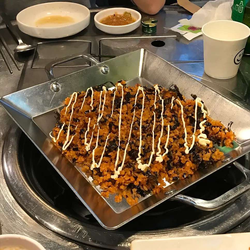 A thick piece of daechang filling the whole spoon